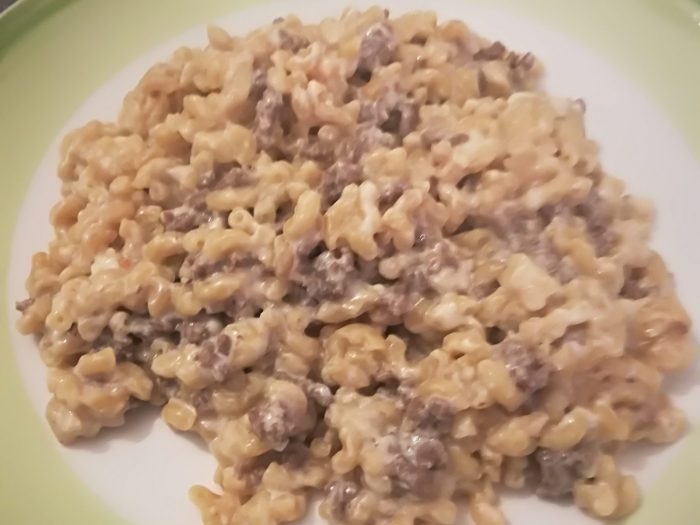 Pasta, steak of ground meat and soft cheese