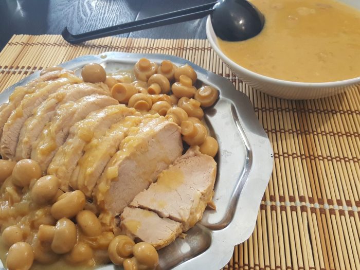 Pork roast with mushrooms, white wine sauce and mustard